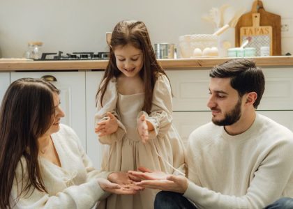 A cheerful family enjoying baking time in their cozy kitchen, fostering love and togetherness.